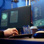ethical hacker working in cybersecurity in front of computers