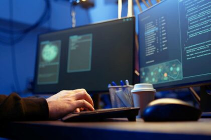 ethical hacker working in cybersecurity in front of computers
