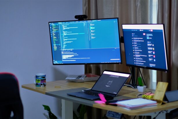black flat screen tv turned on on white table