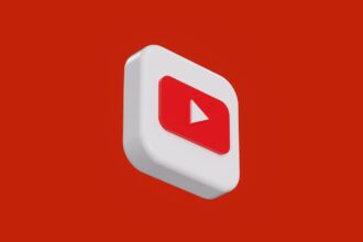 a red and white play button on a red background