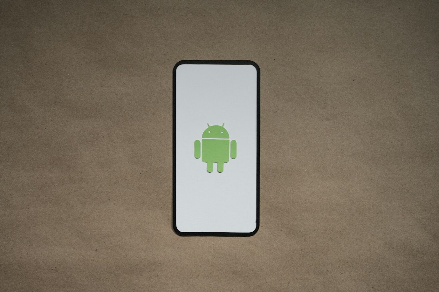 a cell phone with a green icon on it