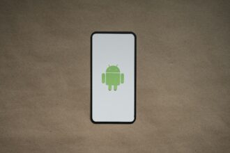 a cell phone with a green icon on it
