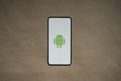 a cell phone with a green icon on it