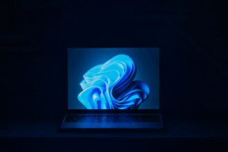 a macbook air laptop in a dark room