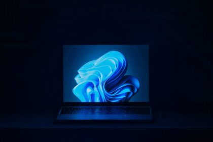 a macbook air laptop in a dark room
