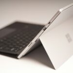 black ipad with keyboard on white table