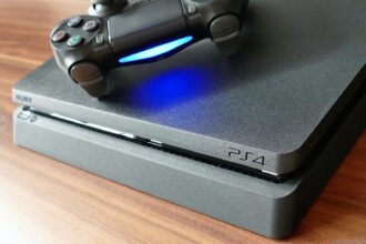 a video game console sitting on top of a wooden table