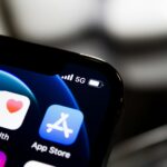 black iphone 4 displaying icons