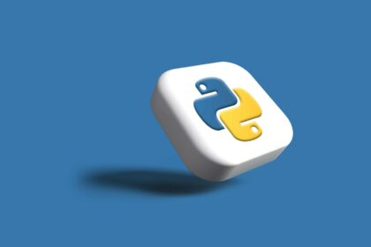 a white cube with a yellow and blue logo on it