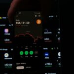 A person holding a cell phone in their hand