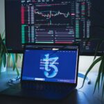a laptop computer sitting on top of a desk