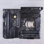 a close up of a computer motherboard on a white surface