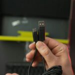 a person holding a usb device in their hand