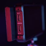 a close up of a red and black device