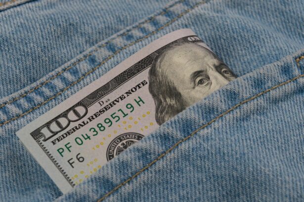 a hundred dollar bill sticking out of the back pocket of a pair of jeans