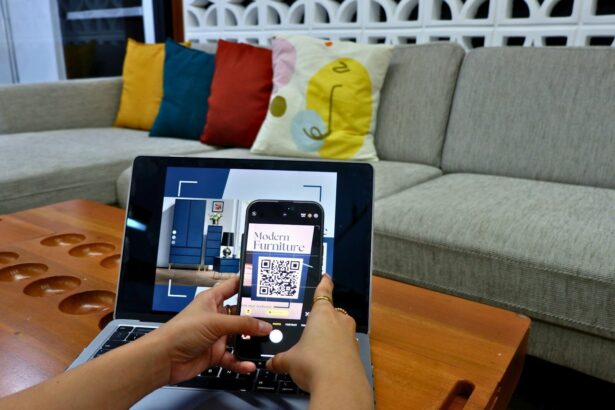 a person using a laptop computer with a qr code on the screen