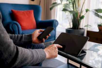 Hands setting up credit freeze on devices