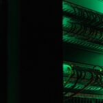 a rack of electronic equipment in a dark room